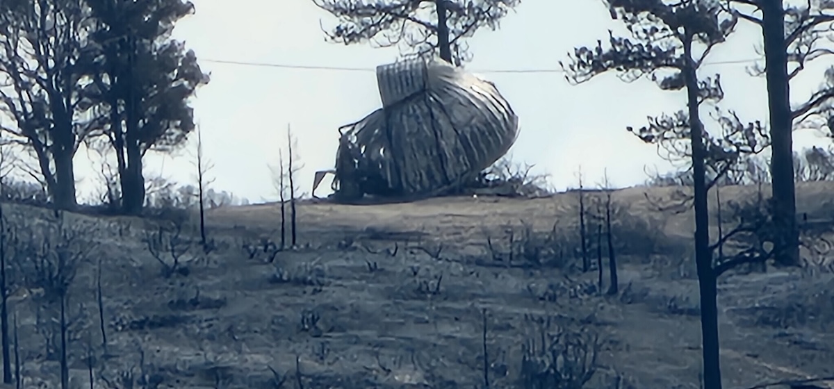 "The melted dome of an observatory, with trees on the foreground."