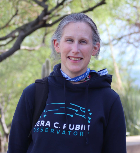 "Headshot of Melissa Graham smiling, trees in background"