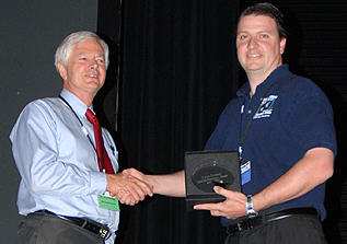 Director Henden presents the AAVSO Director's Award to Vance Petriew